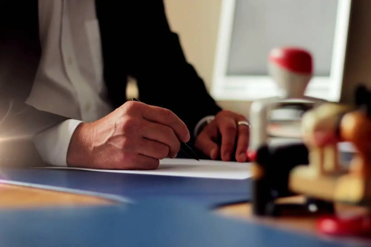 man-hand-writing-on-paper